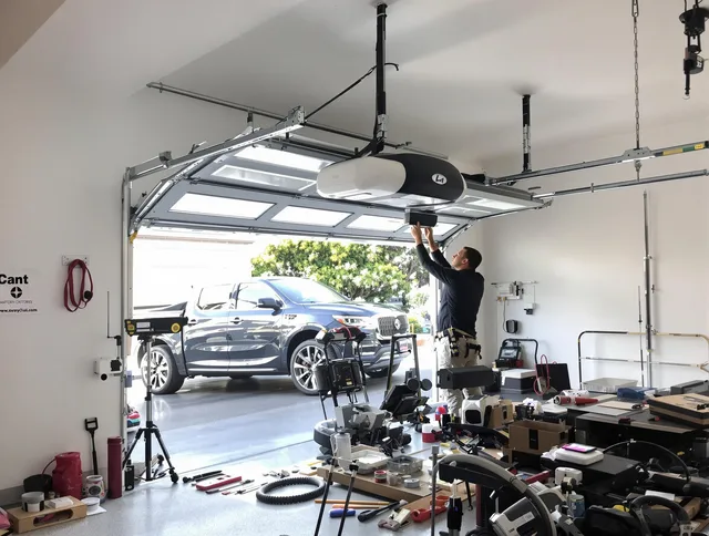 New Fairfield Garage Door Repair specialist installing smart garage door opener system in New Fairfield home