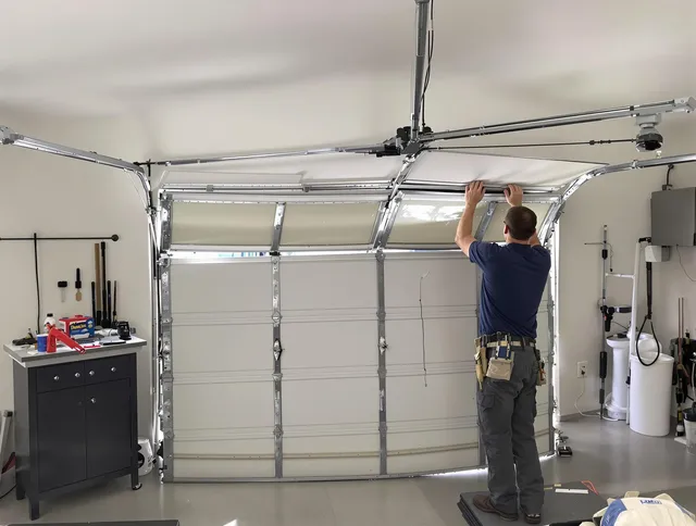 New Fairfield Garage Door Repair specialist performing precise section replacement on New Fairfield garage door