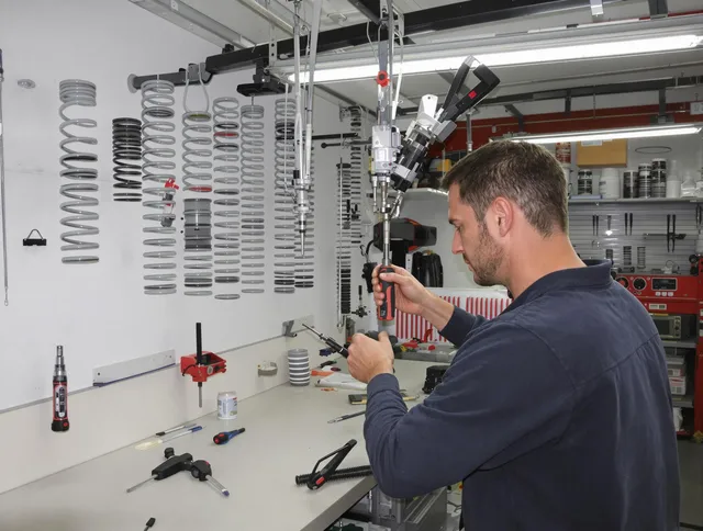 New Fairfield Garage Door Repair safety certified technician performing precision spring replacement in New Fairfield